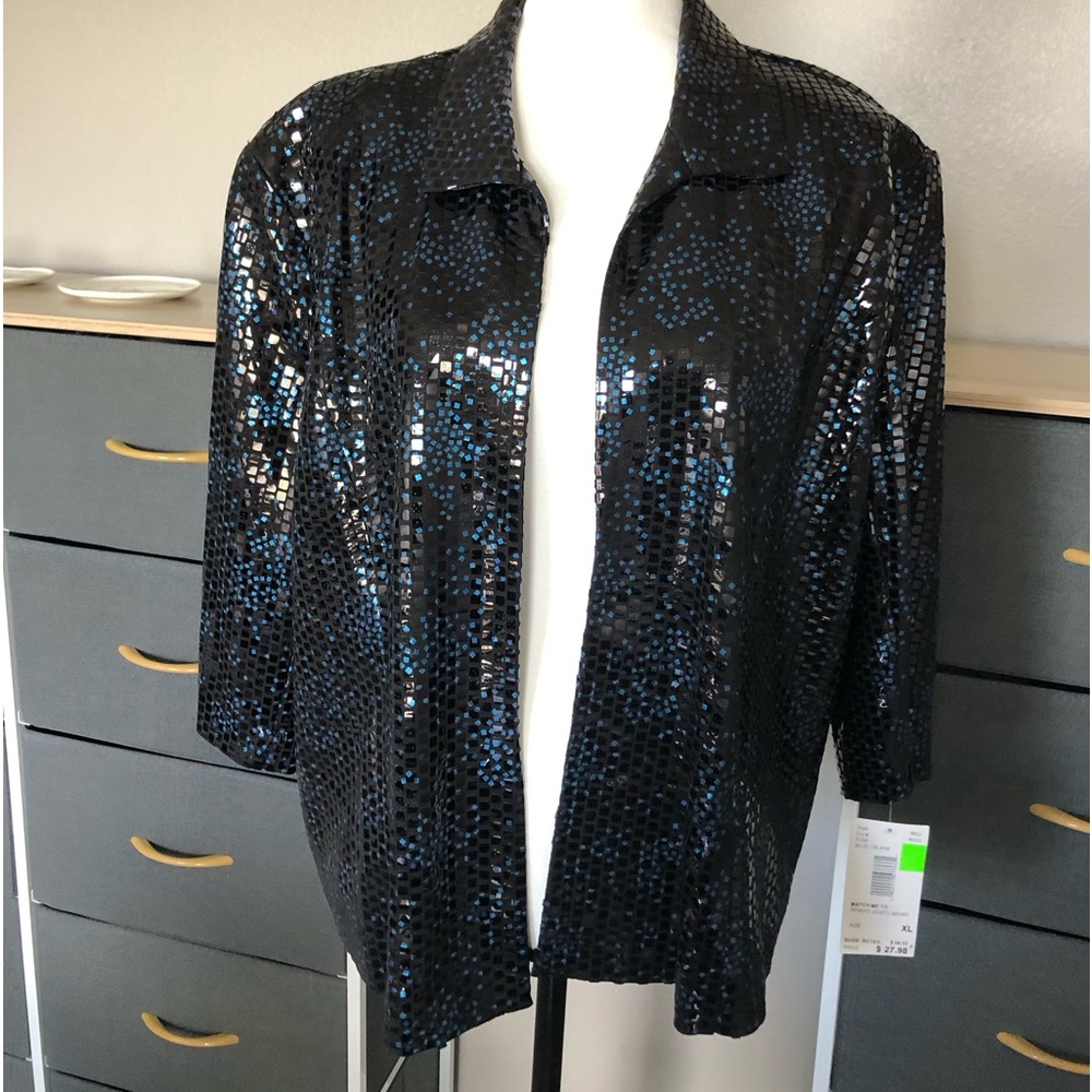This is brand new extra large glitter jacket with tags on